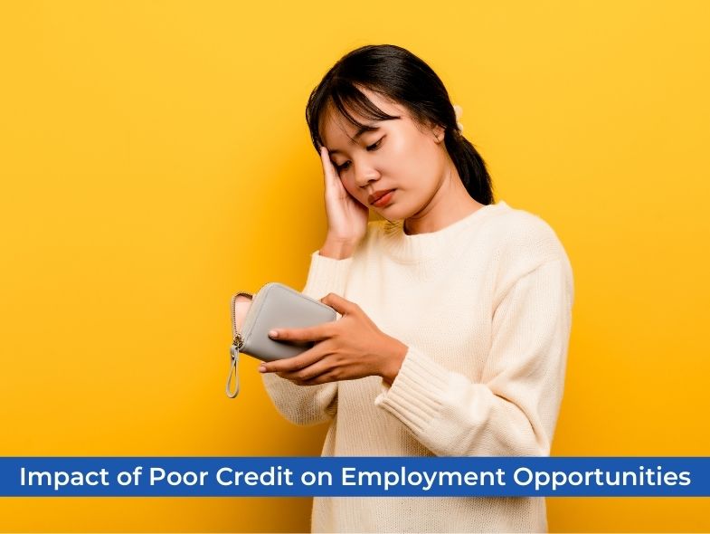 A woman looks at her wallet as she looks worried about her credit status, which may affect her employment opportunities.